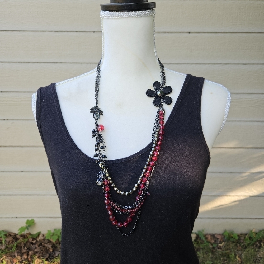 dark layered necklace with red beads flower spider fly charms